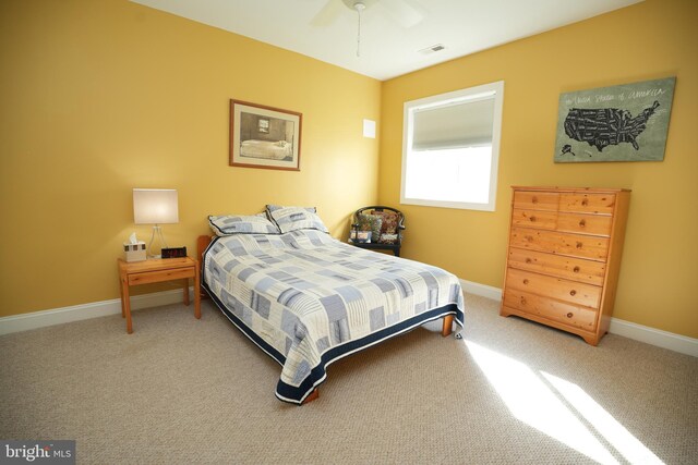 bedroom featuring a ceiling fan, carpet, visible vents, and baseboards