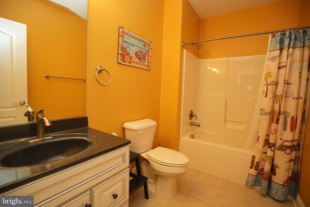 bathroom with shower / bath combo, vanity, toilet, and tile patterned floors