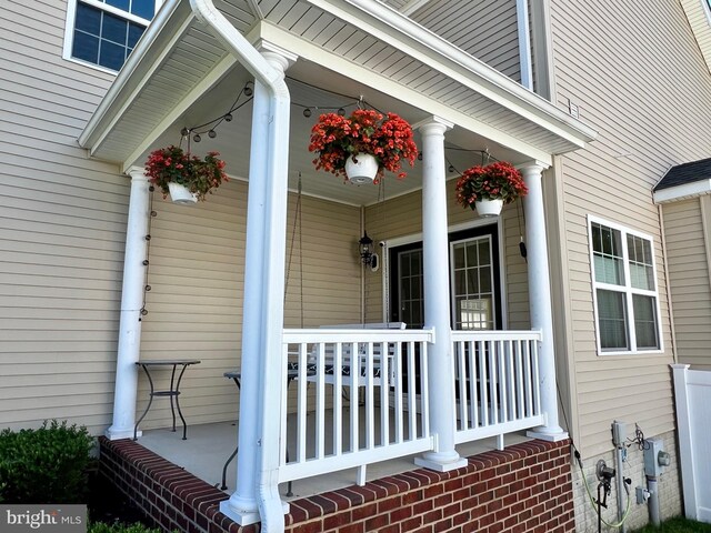 doorway to property with a porch