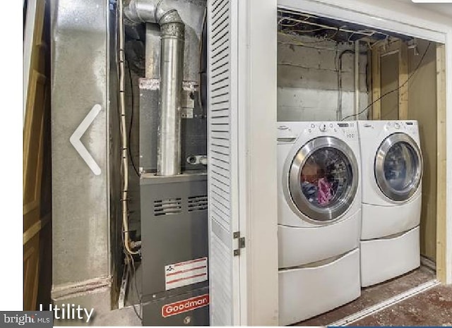 washroom with washing machine and clothes dryer