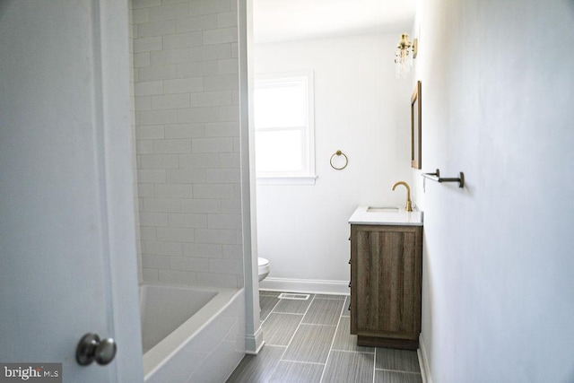 laundry area featuring laundry area, hookup for a washing machine, baseboards, and wood finished floors