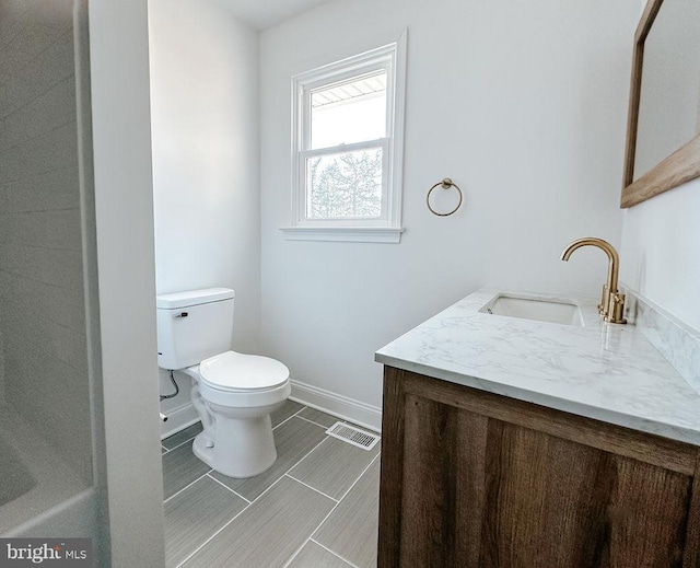 bathroom featuring toilet, visible vents, baseboards, and vanity