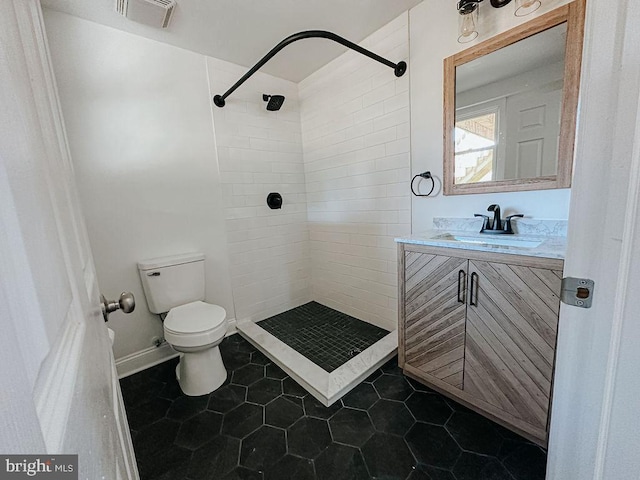 full bathroom with toilet, a shower stall, visible vents, and vanity