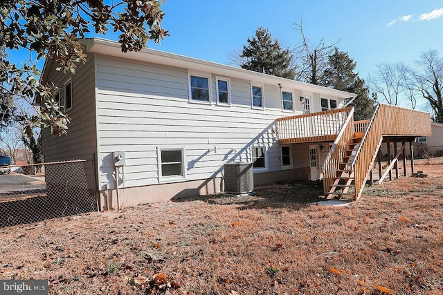 back of property featuring stairs, a wooden deck, and central air condition unit