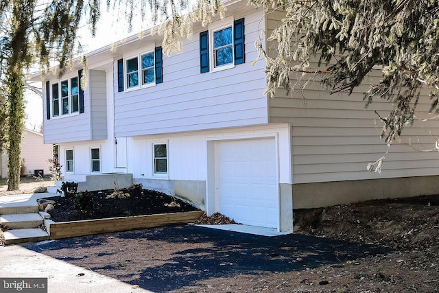 view of side of property featuring a garage