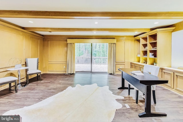 interior space featuring beamed ceiling and hardwood / wood-style flooring