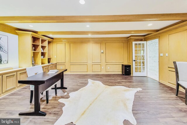 interior space with wood-type flooring and beam ceiling