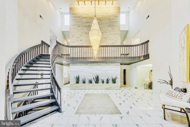 interior space featuring a high ceiling and a wealth of natural light