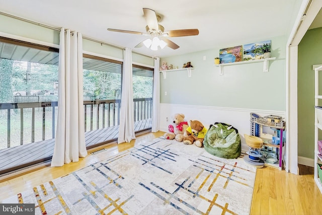 playroom featuring ceiling fan and light hardwood / wood-style floors