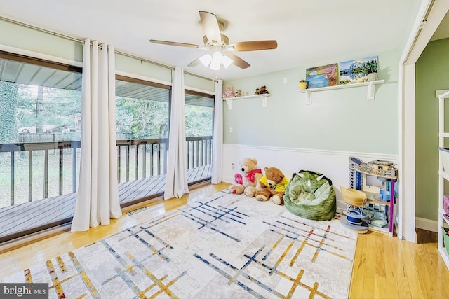 game room featuring ceiling fan, visible vents, and wood finished floors