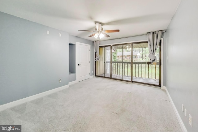 carpeted empty room with ceiling fan