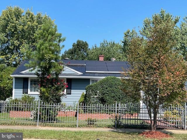 view of front facade with solar panels