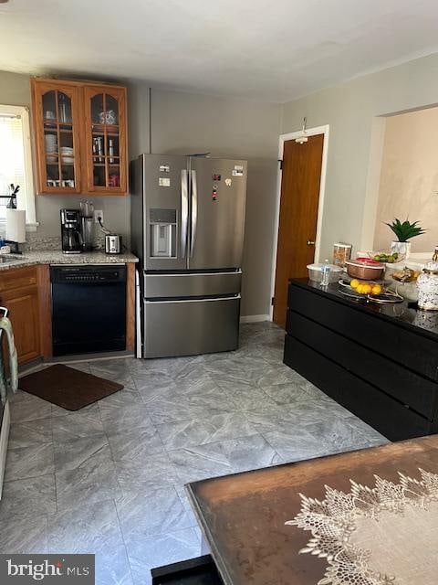 kitchen with stainless steel refrigerator with ice dispenser and dishwasher