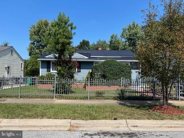 view of front of home featuring solar panels