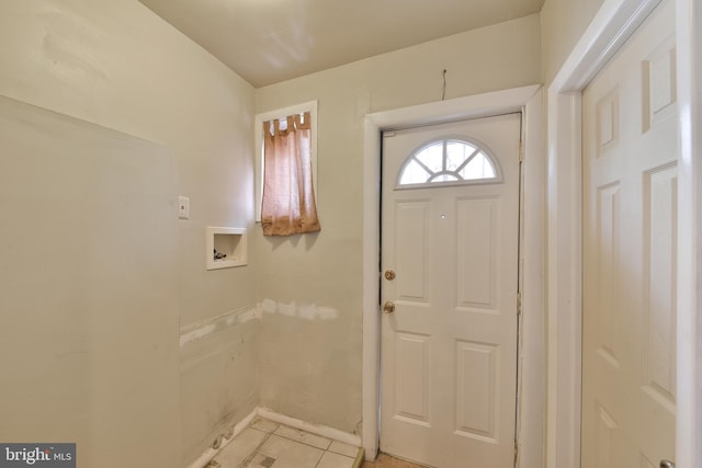 foyer entrance with light tile patterned floors