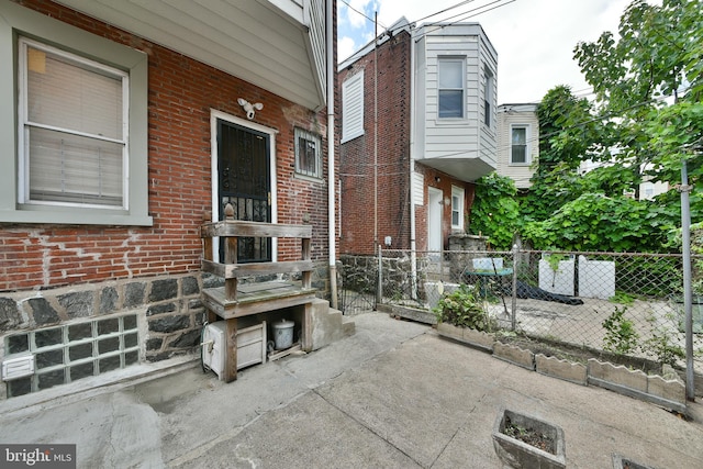 view of patio featuring fence