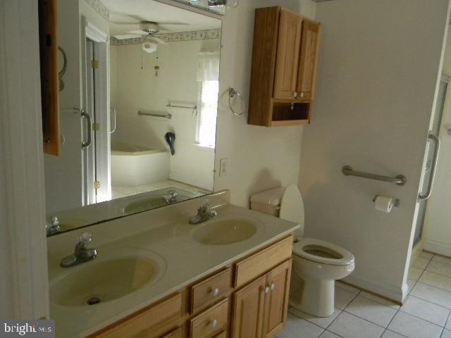 full bathroom featuring toilet, separate shower and tub, tile patterned floors, vanity, and ceiling fan