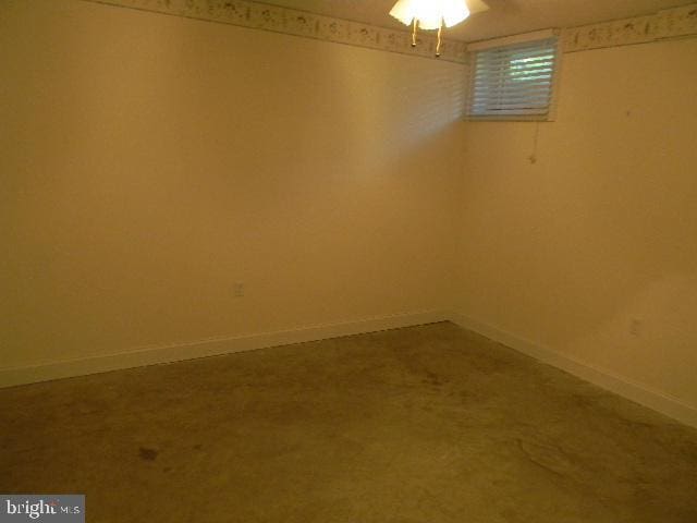 basement with carpet flooring and baseboards