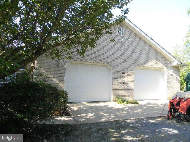 view of side of home featuring a garage