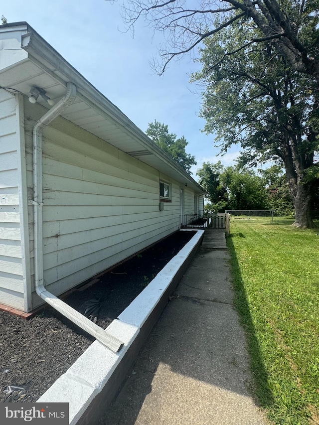 view of home's exterior featuring a lawn