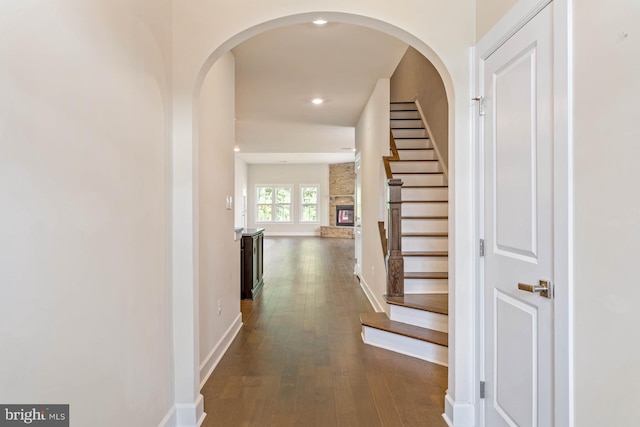 hall with dark hardwood / wood-style flooring