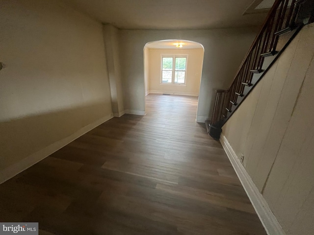 hallway with dark wood-type flooring