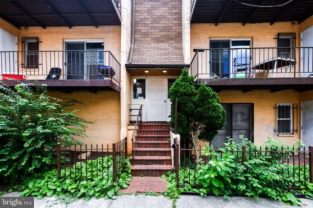 doorway to property featuring a balcony