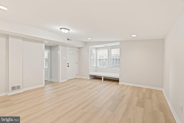 unfurnished room featuring light hardwood / wood-style floors