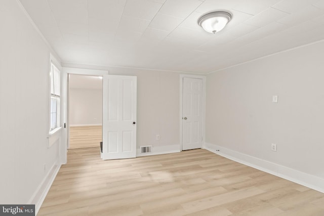 unfurnished room featuring light hardwood / wood-style flooring