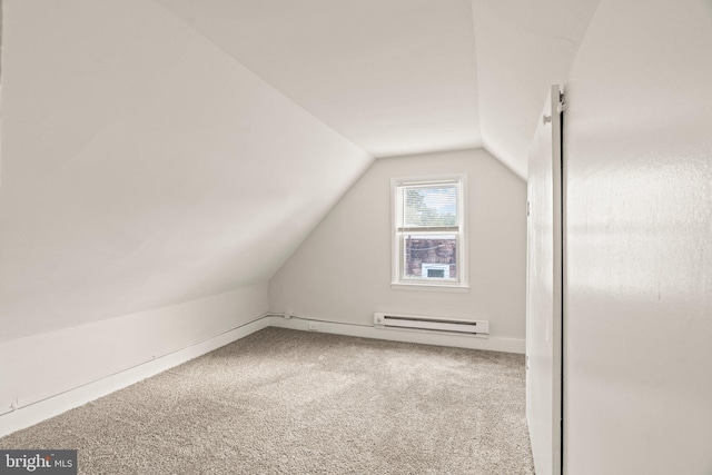 bonus room with a baseboard radiator, lofted ceiling, and carpet