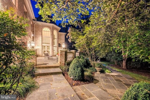 view of patio at twilight