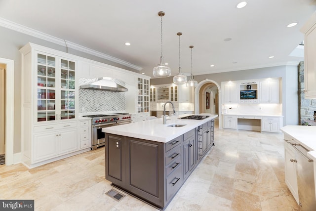 kitchen featuring gray cabinetry, white cabinetry, wall chimney exhaust hood, pendant lighting, and double oven range