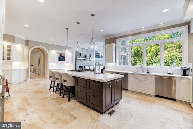 kitchen featuring white cabinetry, a kitchen island with sink, and stainless steel dishwasher