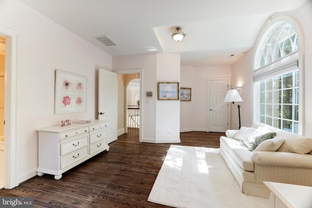 living room with dark hardwood / wood-style floors