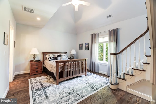 bedroom with lofted ceiling, dark hardwood / wood-style floors, and ceiling fan