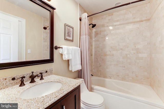 full bathroom with vanity, toilet, and shower / tub combo with curtain