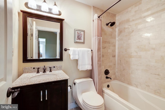 full bathroom with shower / bath combo, vanity, and toilet