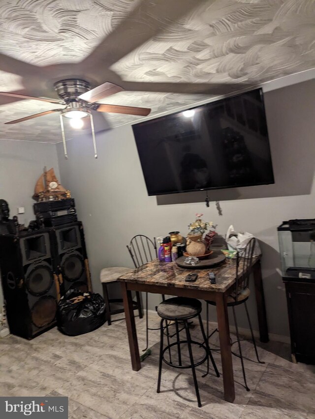 dining area with ceiling fan