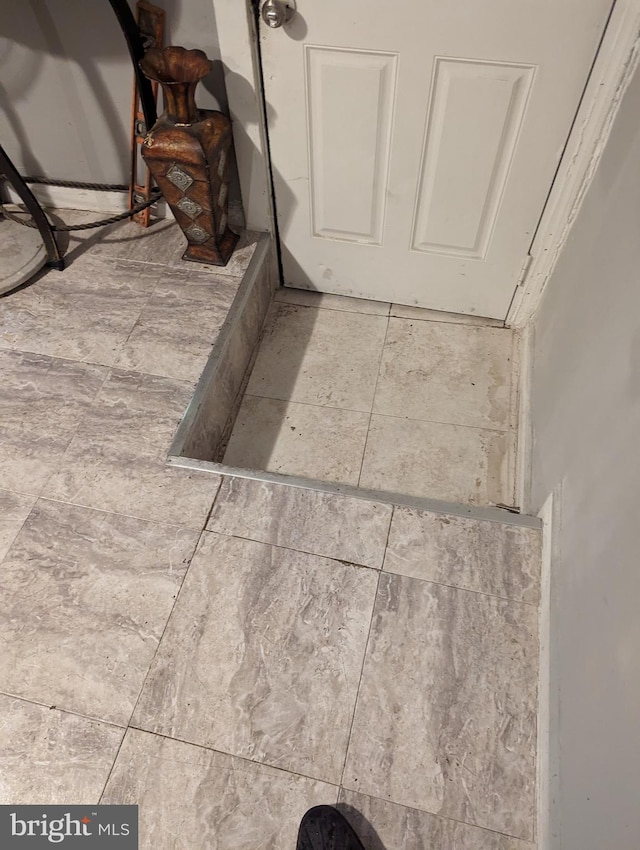 interior details featuring tile patterned floors