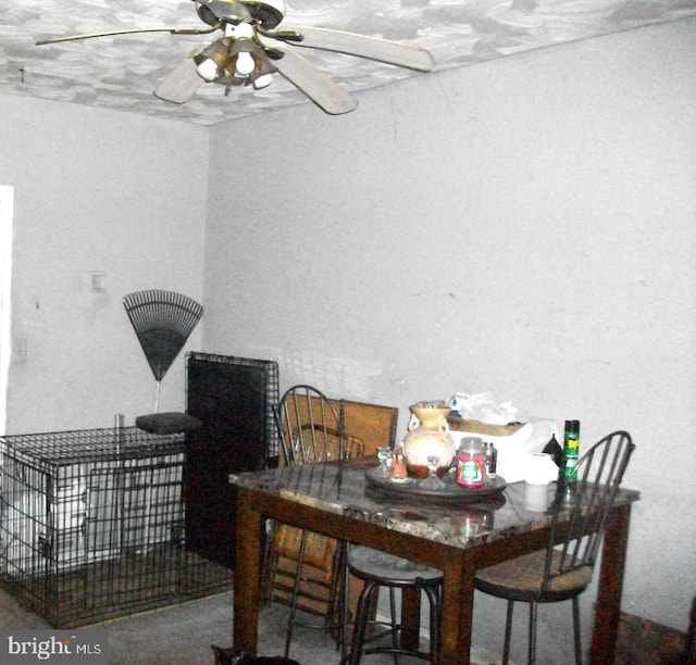 dining space featuring ceiling fan