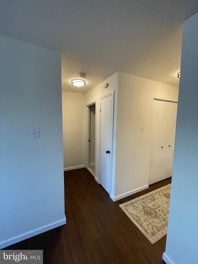 hallway featuring dark hardwood / wood-style floors