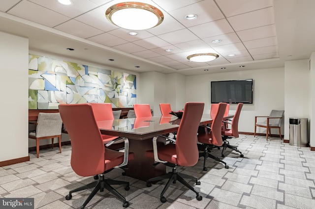 carpeted dining room featuring a drop ceiling, recessed lighting, and baseboards