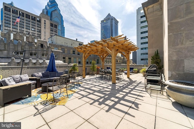 view of patio featuring a city view, a pergola, and an outdoor hangout area