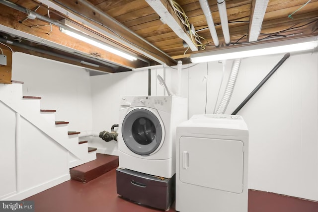 laundry area with washing machine and dryer