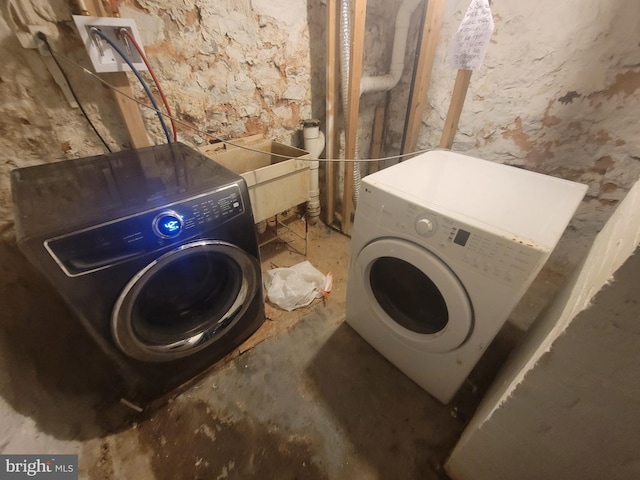 clothes washing area with laundry area and separate washer and dryer