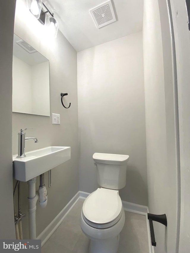 bathroom with toilet and sink