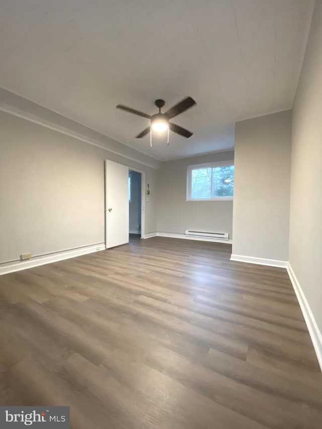 unfurnished room with ceiling fan, hardwood / wood-style flooring, and a baseboard radiator