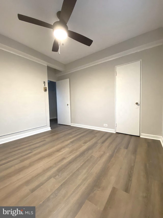 spare room featuring ceiling fan and hardwood / wood-style flooring