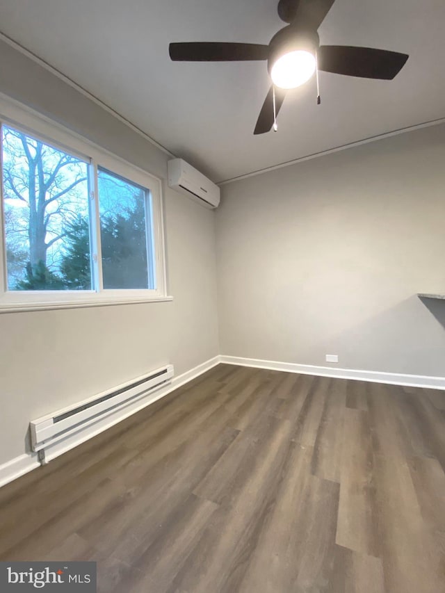 unfurnished room featuring ceiling fan, dark hardwood / wood-style floors, a wall unit AC, and a baseboard radiator