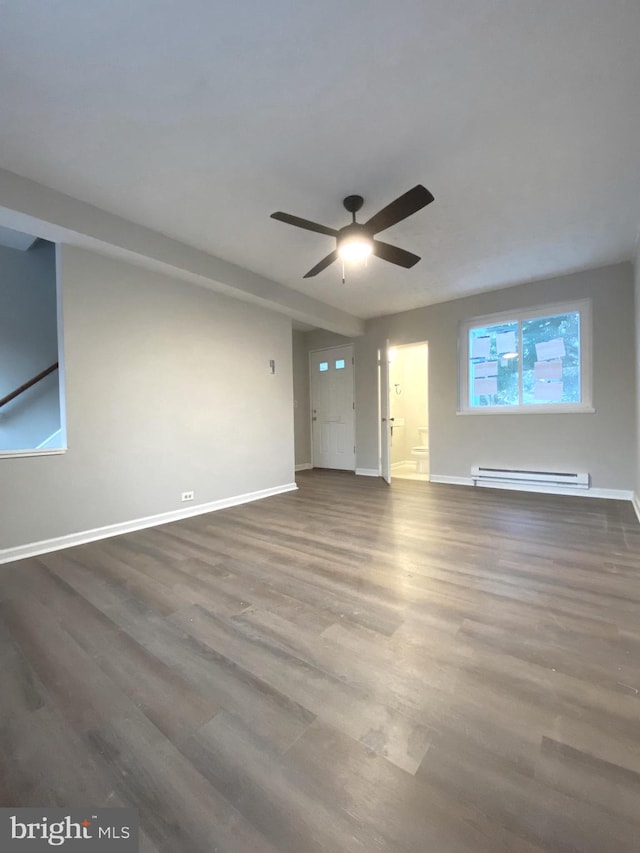 empty room with a baseboard heating unit, ceiling fan, and hardwood / wood-style flooring